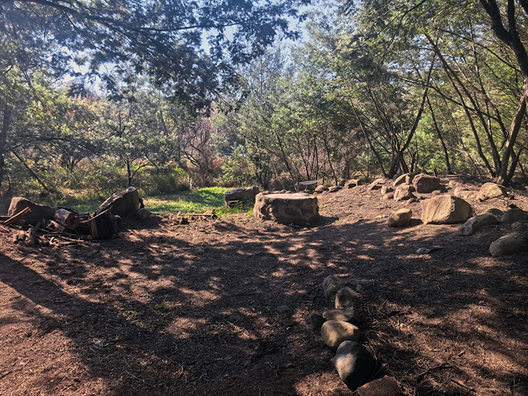 Camp 2 • Whispering Spirit - Fire pit ringed with stone