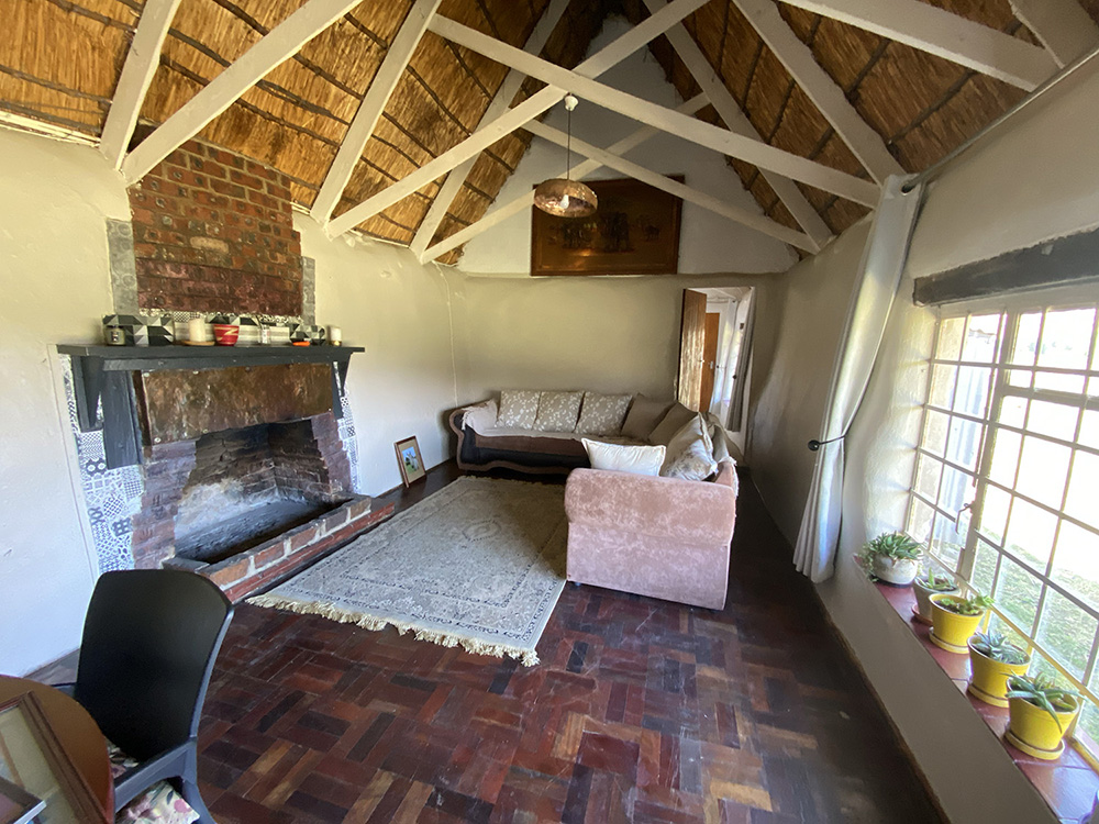 4-Bedroom Pet-Friendly Fisherman's Cottage: Heron - Lounge with fireplace and parquet floors