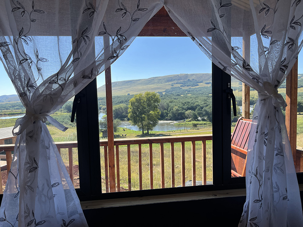 1-Bedroom Pet-Friendly Riverside Cabin 6: Ruach - River view through the bedroom window