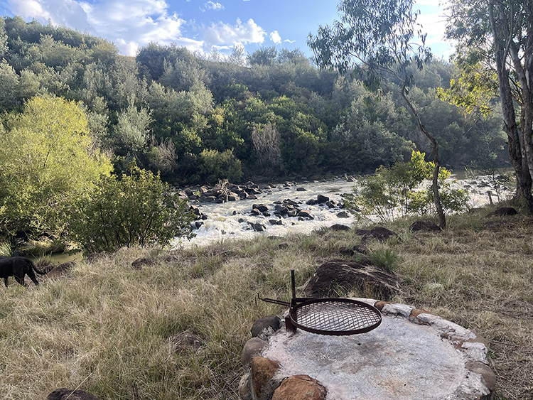 Camp 8 • Breath of Heaven - Fire pit overlooking the rapids