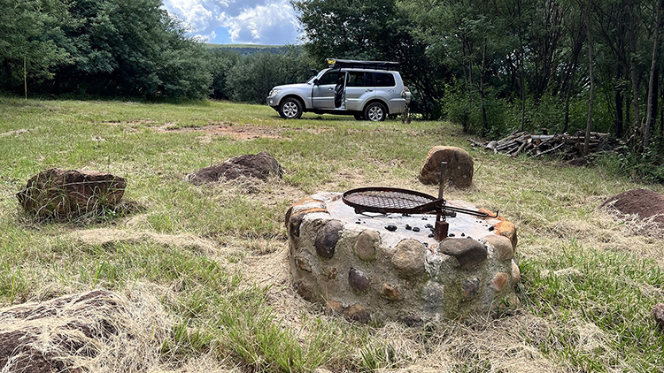 Camp 8 • Breath of Heaven - Fire pit and parking in the open clearing