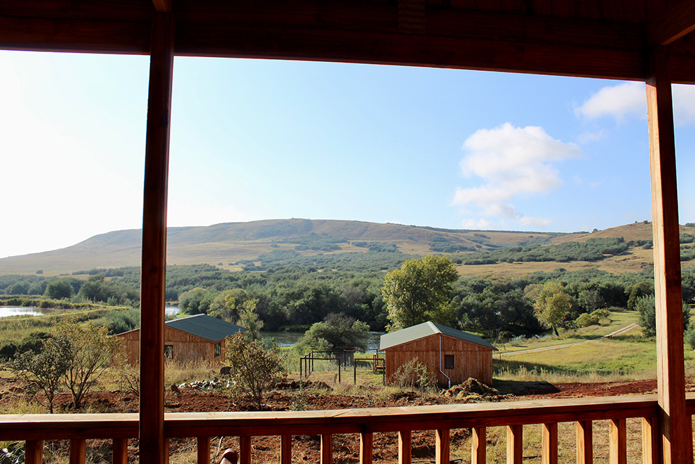 1-Bedroom Pet-Friendly Riverside Cabin 2: Selah - Hillside and river view from the deck