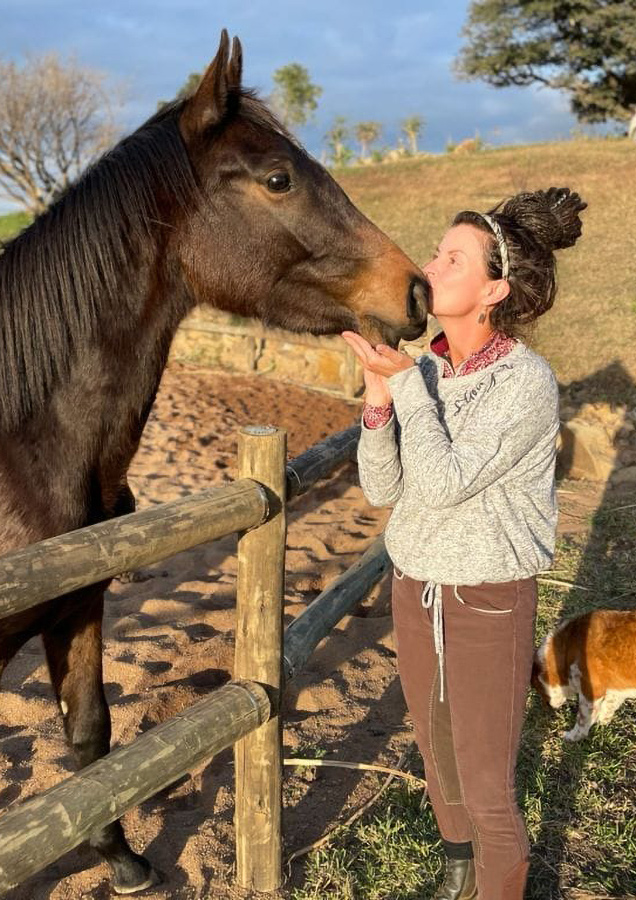 Image: close peaceful horse portrait / Donna with horse